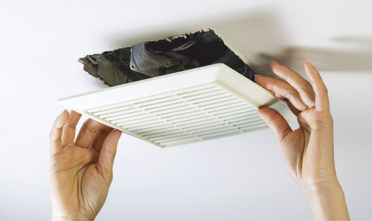 Trifecta technician doing AC duct cleaning service
